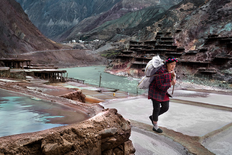 The woman carrying salt